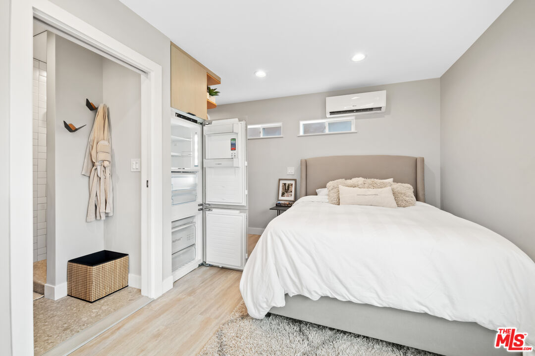 7520 Earldom Avenue Playa del Rey, CA 90293 - Photo 24 of 28 a bedroom with a bed and a refrigerator