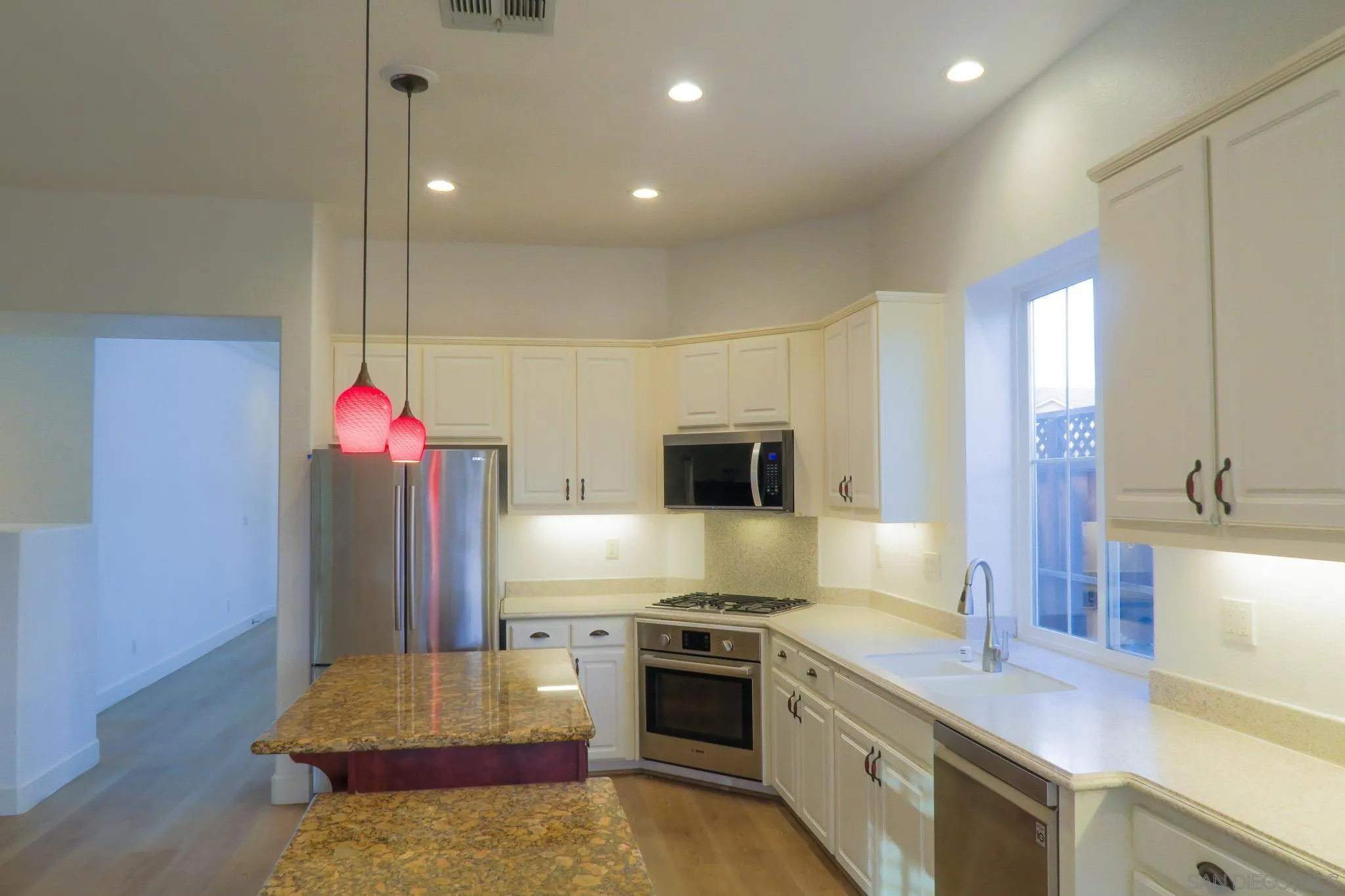 1220 Exeter Way Brentwood, CA 94513 - Photo 11 of 33 a kitchen with stainless steel appliances granite countertop a sink refrigerator and microwave