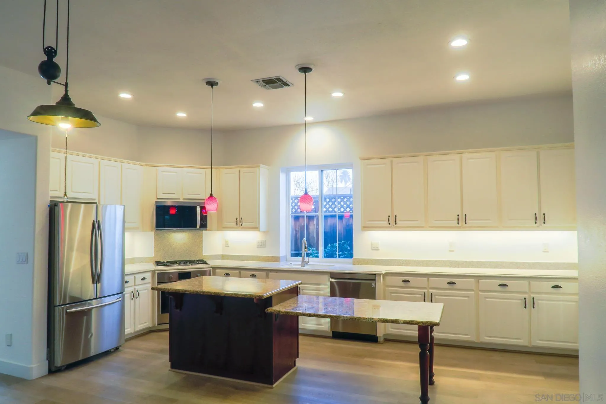 1220 Exeter Way Brentwood, CA 94513 - Photo 9 of 33 a kitchen with kitchen island stainless steel appliances a stove and refrigerator