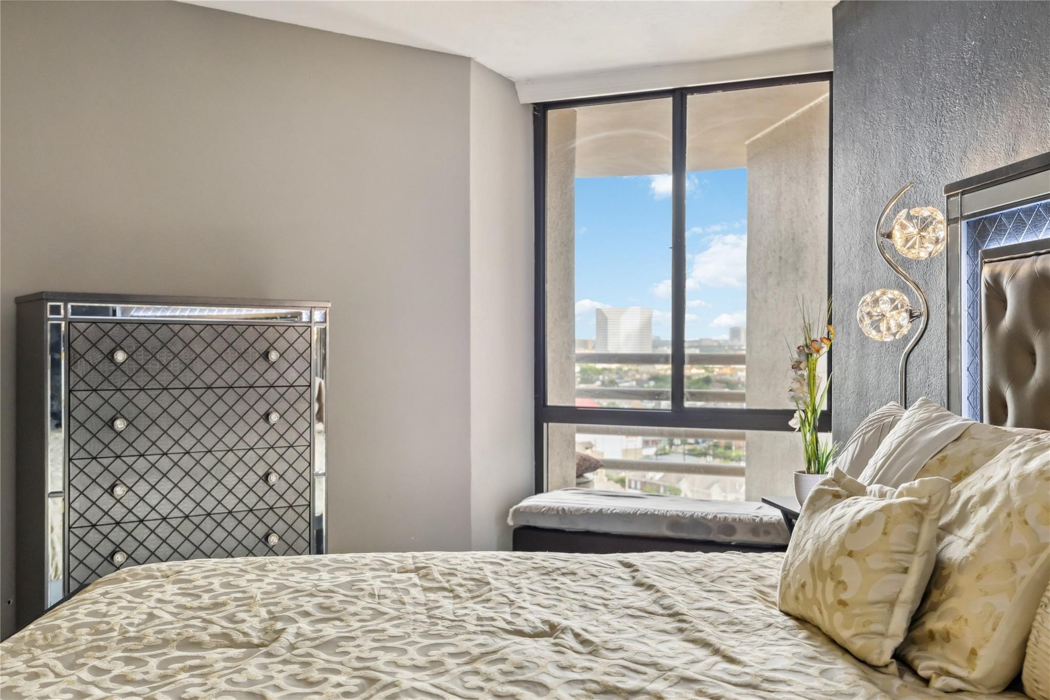 3525 Sage Road, Unit 1713 Houston, TX 77056 - Photo 11 of 25 Large window offers plenty of natural light and a city view, enhancing the room's inviting atmosphere.