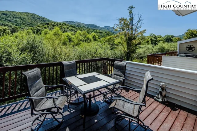 a view of a balcony with furniture