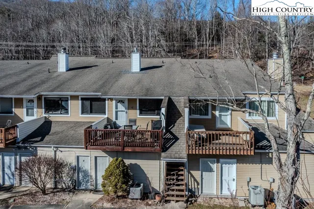 a front view of house with yard outdoor seating and barbeque oven