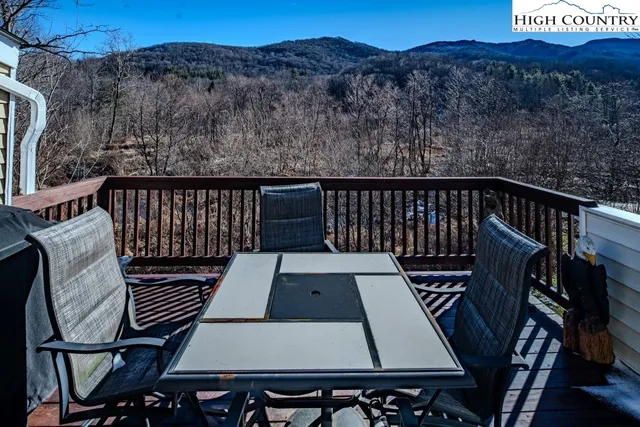 a living room with furniture and a lamp