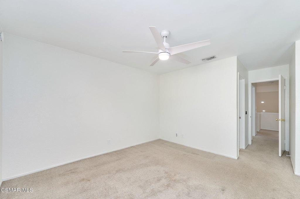 5368 Rainwood Street, Unit 65 Simi Valley, CA 93063 - Photo 24 of 34 an empty room with a ceiling fan and a window