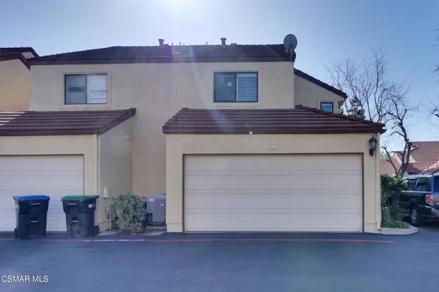 a view of a house with a street
