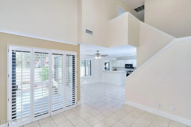 a view of entryway and kitchen