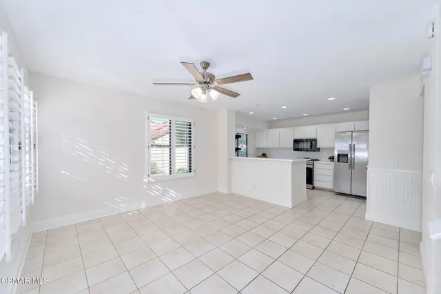 a view of kitchen with furniture and window