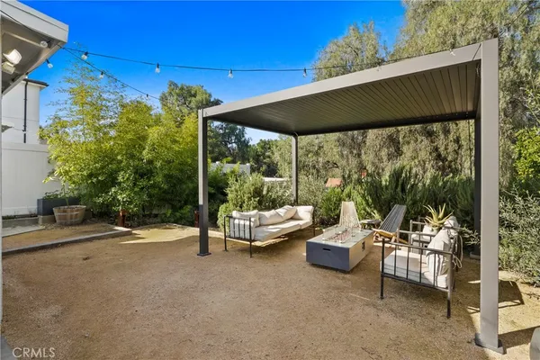 a outdoor living space with furniture and garden view