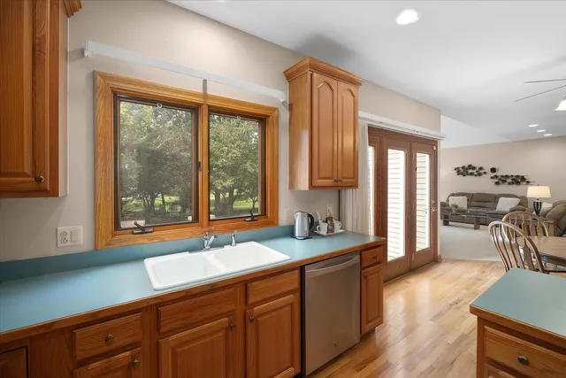 a spacious bathroom with sinks a large mirror and a shower