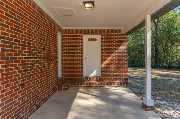 a view of a pathway with a house