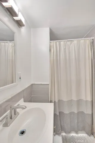 a bathroom with a sink and a bathtub
