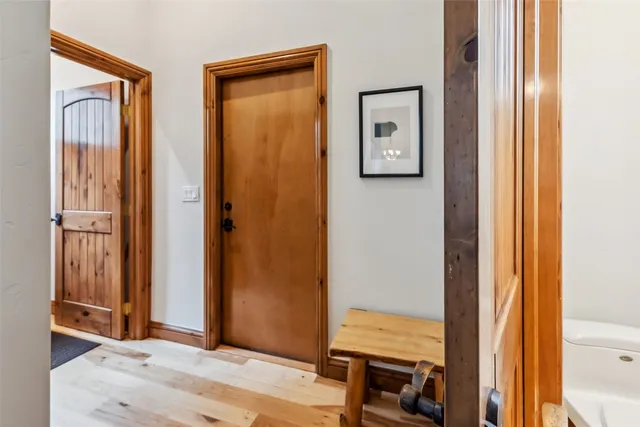 a view of front door with wooden floor