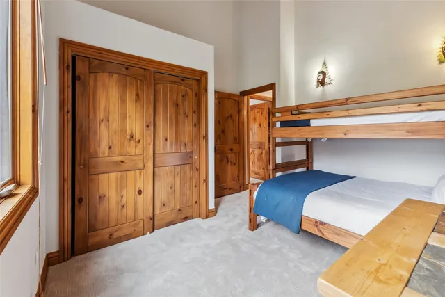 a bedroom with a bed and a cabinets