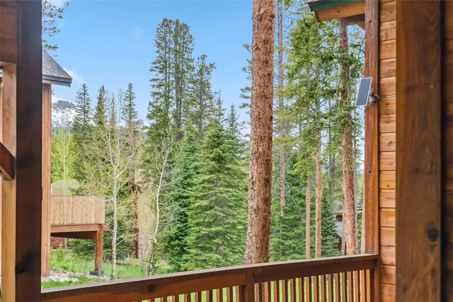 a brick house with a yard and plants