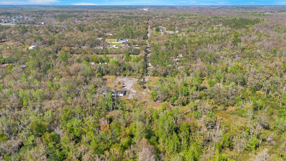 953 Baron Road Orlando, FL 32828 - Photo 11 of 15 a view of a city with lush green forest