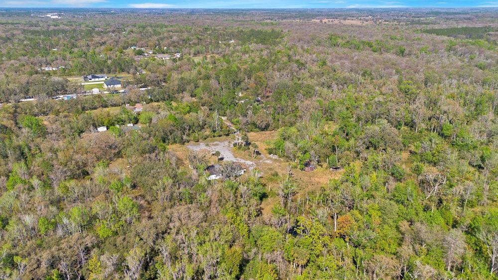 953 Baron Road Orlando, FL 32828 - Photo 12 of 15 a view of a city with lush green forest
