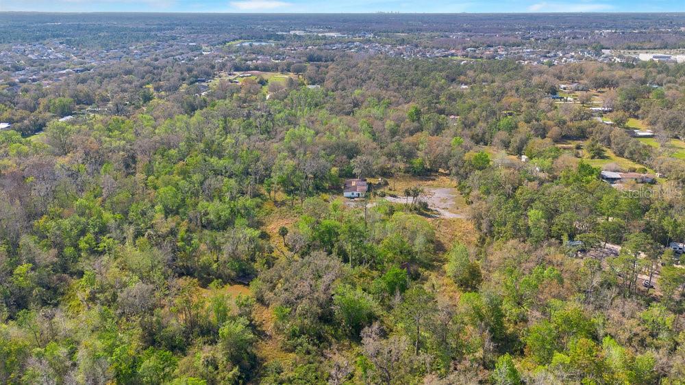 953 Baron Road Orlando, FL 32828 - Photo 9 of 15 an aerial view of residential houses with outdoor space and trees