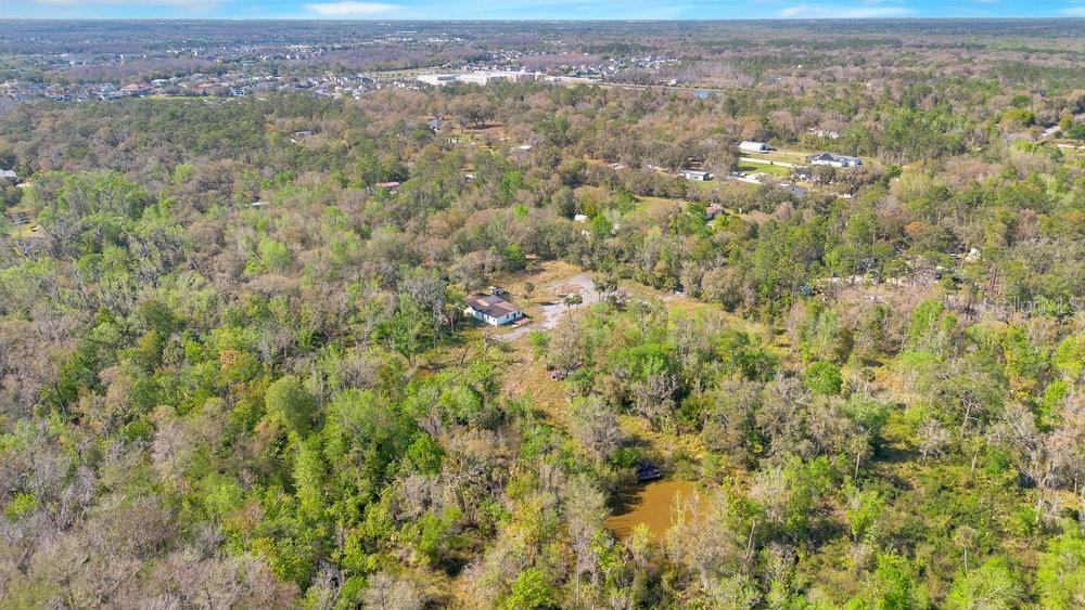 953 Baron Road Orlando, FL 32828 - Photo 10 of 15 an aerial view of residential houses with outdoor space and trees
