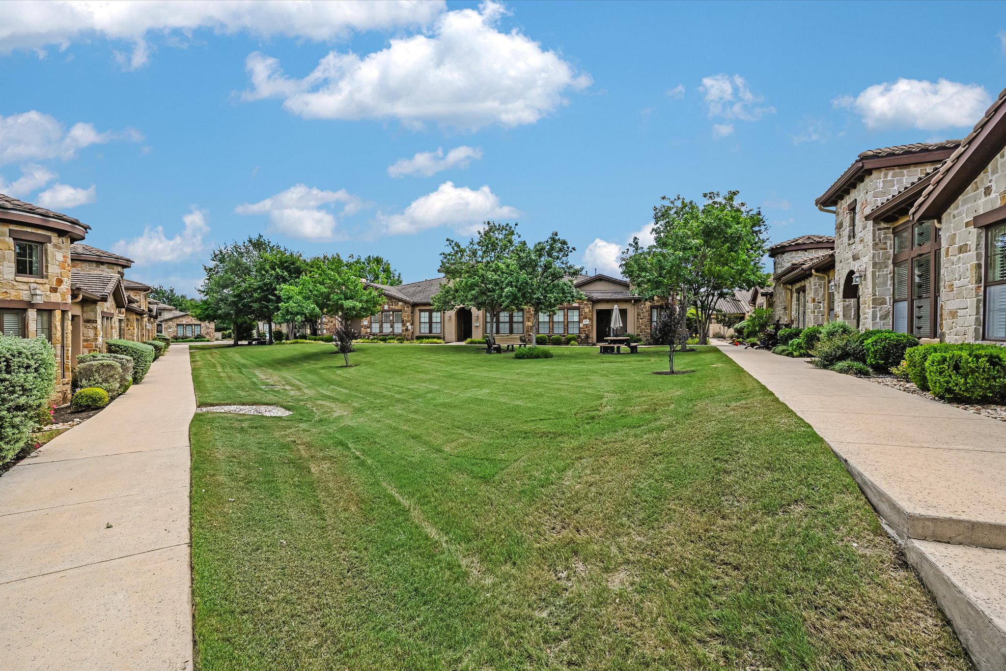 103 Rivalto Circle, Unit 1 Lakeway, TX 78734 - Photo 20 of 34 Wonderful open green space called the Townhome Triangle at Tuscan Village