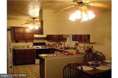 394 Morgan Ford Road Front Royal, VA 22630 - Photo 2 of 10 a room with a sink and a stove
