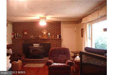 394 Morgan Ford Road Front Royal, VA 22630 - Photo 4 of 10 a living room with furniture a window and a fireplace