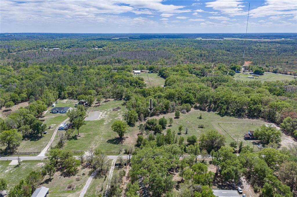 0 Clayton Road Kathleen, FL 33849 - Photo 4 of 41 an aerial view of residential houses with outdoor space and trees