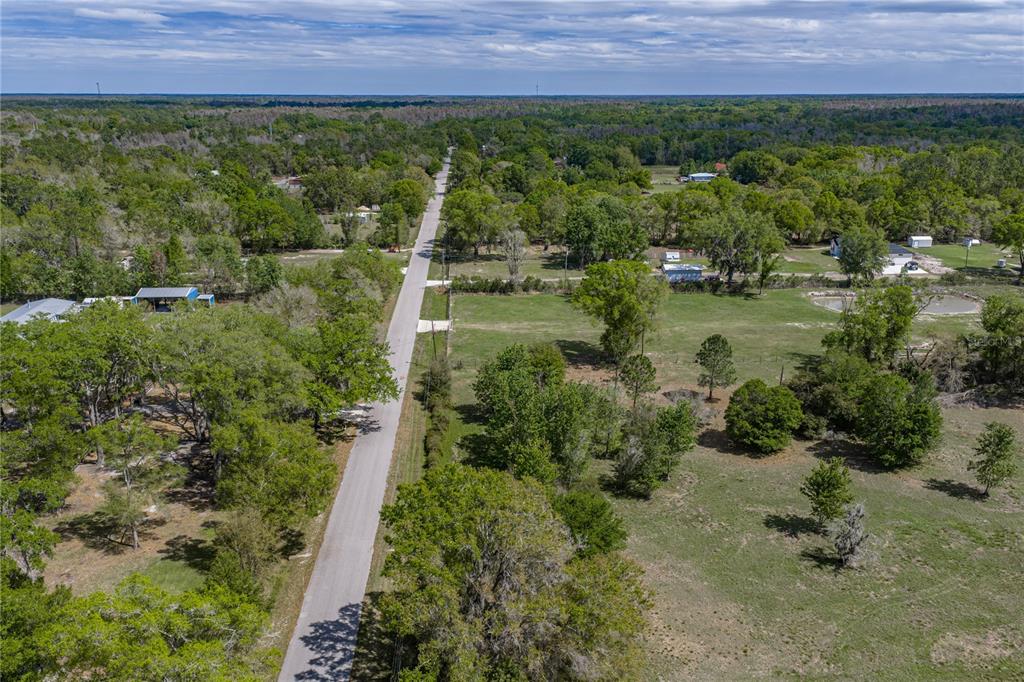 0 Clayton Road Kathleen, FL 33849 - Photo 9 of 41 an aerial view of residential house with outdoor space and trees all around