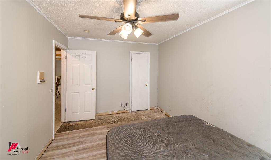 423 11th Street Northeast Springhill, LA 71075 - Photo 16 of 24 Interior room featuring light gray painted walls, a textured white ceiling, and white baseboards