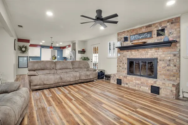 a kitchen with stainless steel appliances granite countertop a sink and a refrigerator