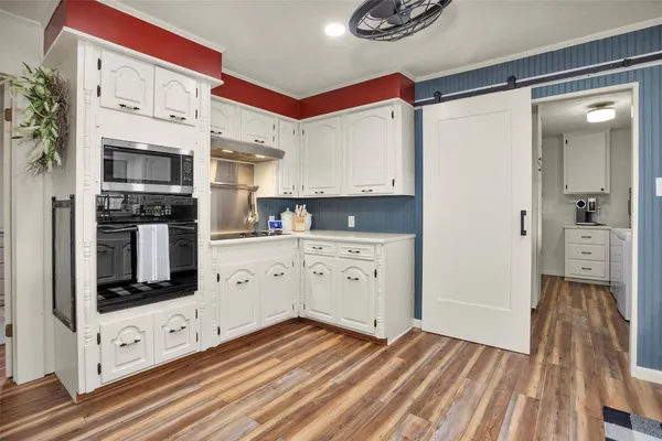 a view of a patio with table and chairs