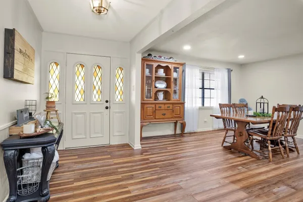 a living room with fireplace furniture and a flat screen tv