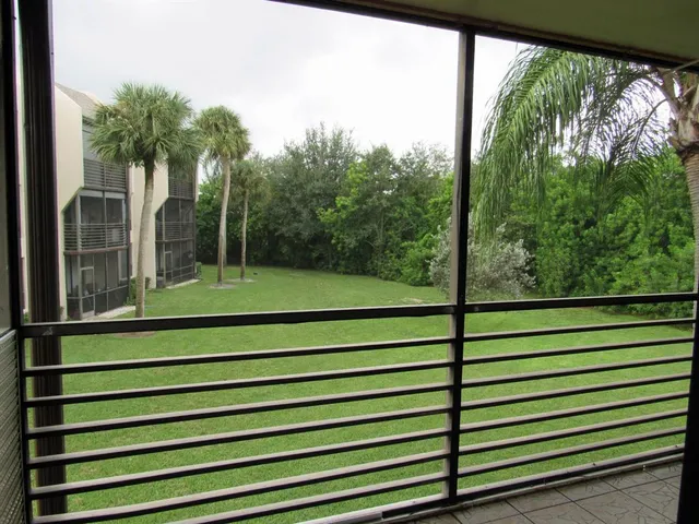 a kitchen with granite countertop a sink a stove and cabinets
