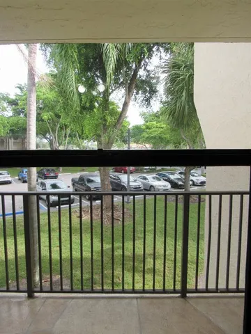 a view of kitchen and dining space with chandelier