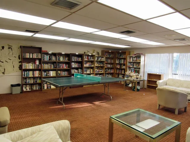 a backyard of apartments with large tree