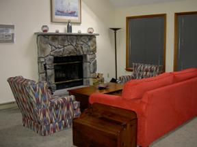 7753 Kilmer Road Tobyhanna, PA 18466 - Photo 5 of 9 living room with stone faced fireplace