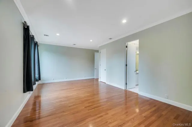 a view of a kitchen with a large window