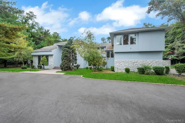 a kitchen with stainless steel appliances a stove a sink a oven a counter top space and cabinets