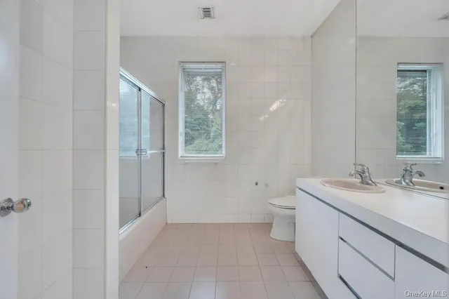 a bathroom with a shower and a toilet
