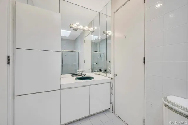 a view of a room with wooden floor and window