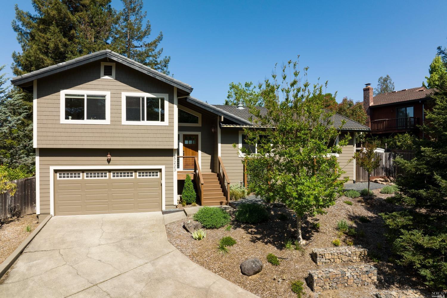 5223 Beaumont Way Santa Rosa, CA 95409 - Photo 1 of 1 a front view of a house with a yard and garage