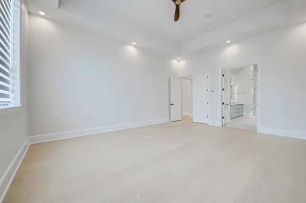 a bathroom with a double vanity sink mirror and shower