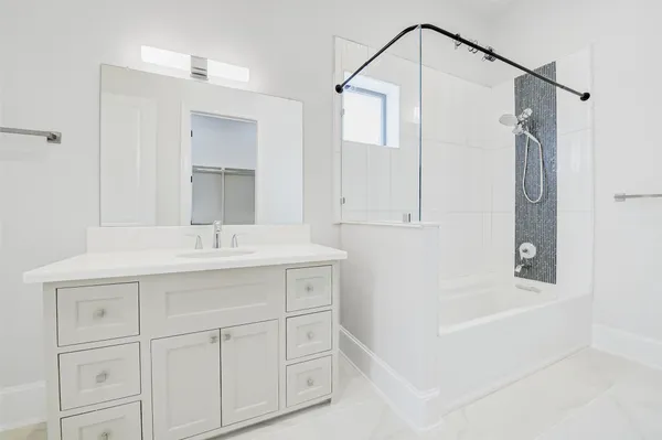 a bathroom with a sink and a bathtub