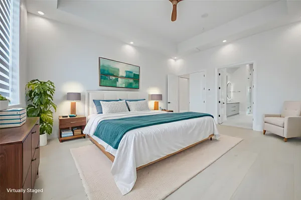 a bedroom with a bed and a couch