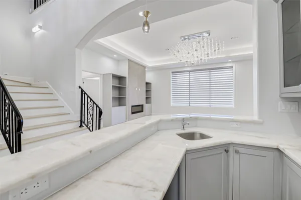a bathroom with a sink a vanity and a mirror