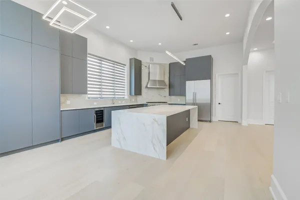 a kitchen with a stove and a refrigerator