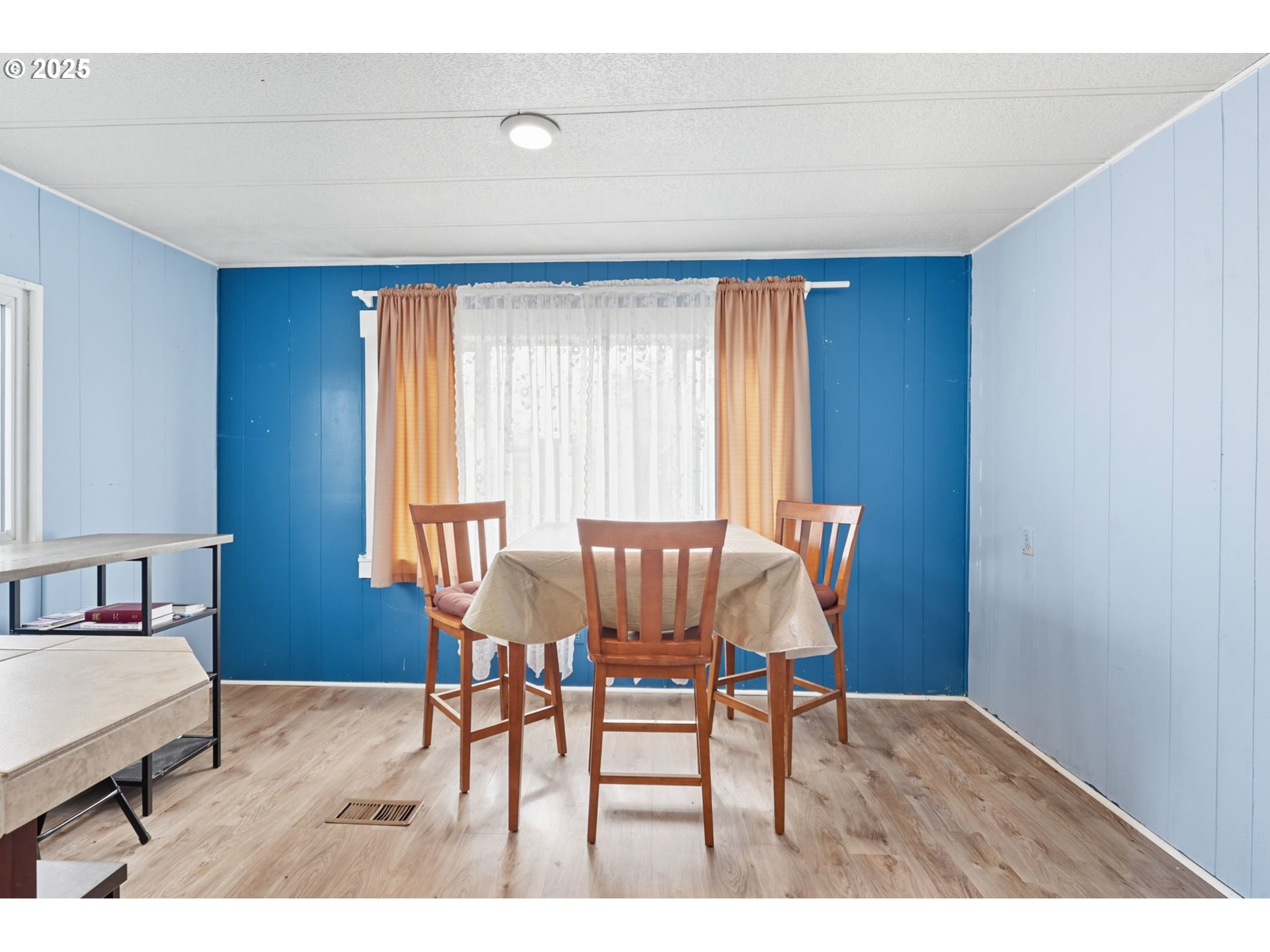 300 Southwest 7th Avenue, Unit 95 Battle Ground, WA 98604 - Photo 11 of 27 a view of a dining room with furniture and a window