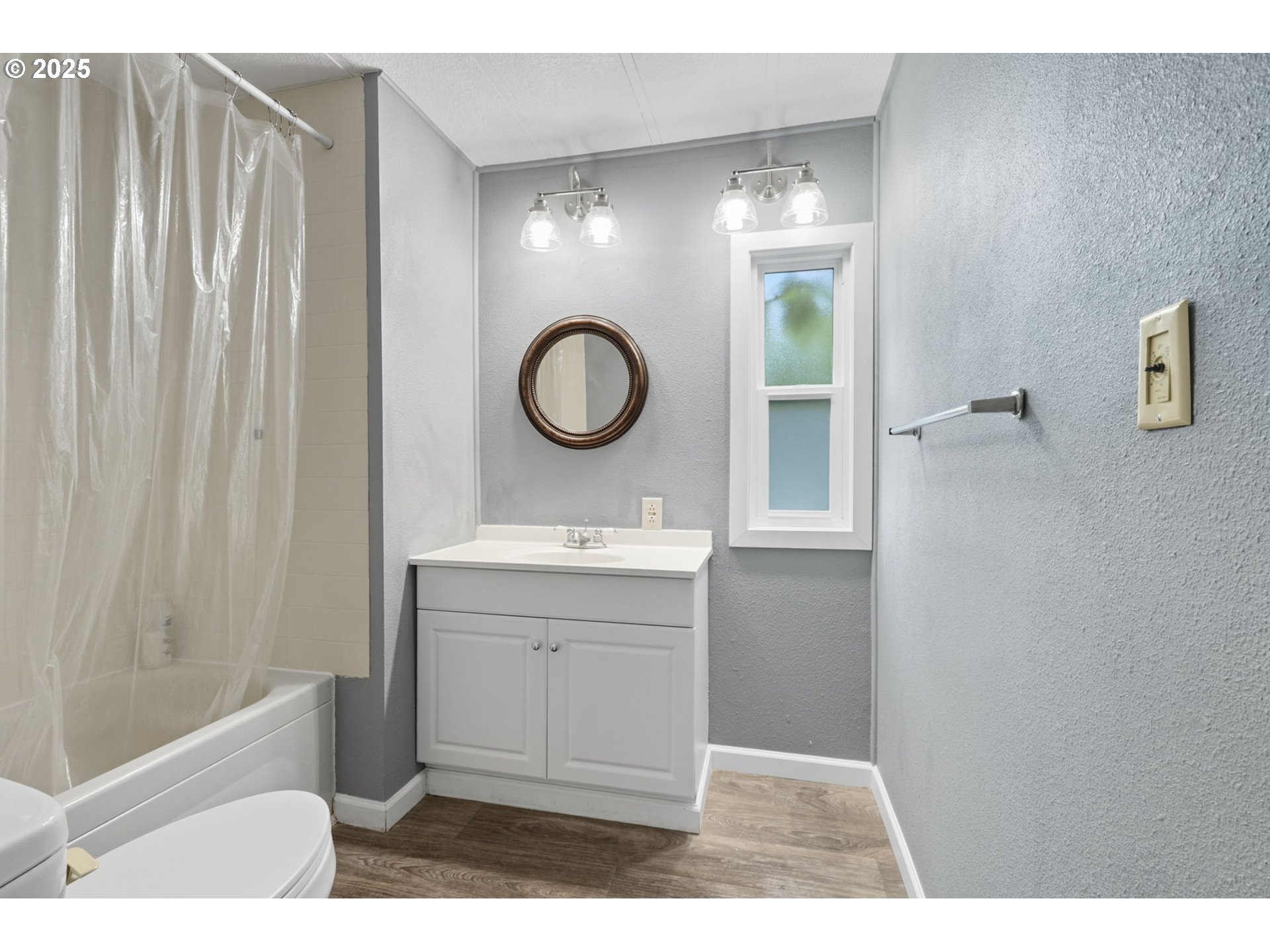 300 Southwest 7th Avenue, Unit 95 Battle Ground, WA 98604 - Photo 13 of 27 a bathroom with a sink a toilet and a shower
