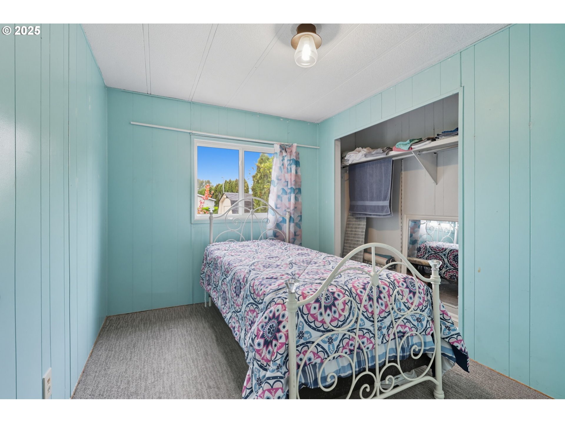300 Southwest 7th Avenue, Unit 95 Battle Ground, WA 98604 - Photo 14 of 27 a bedroom with a bed and a dresser