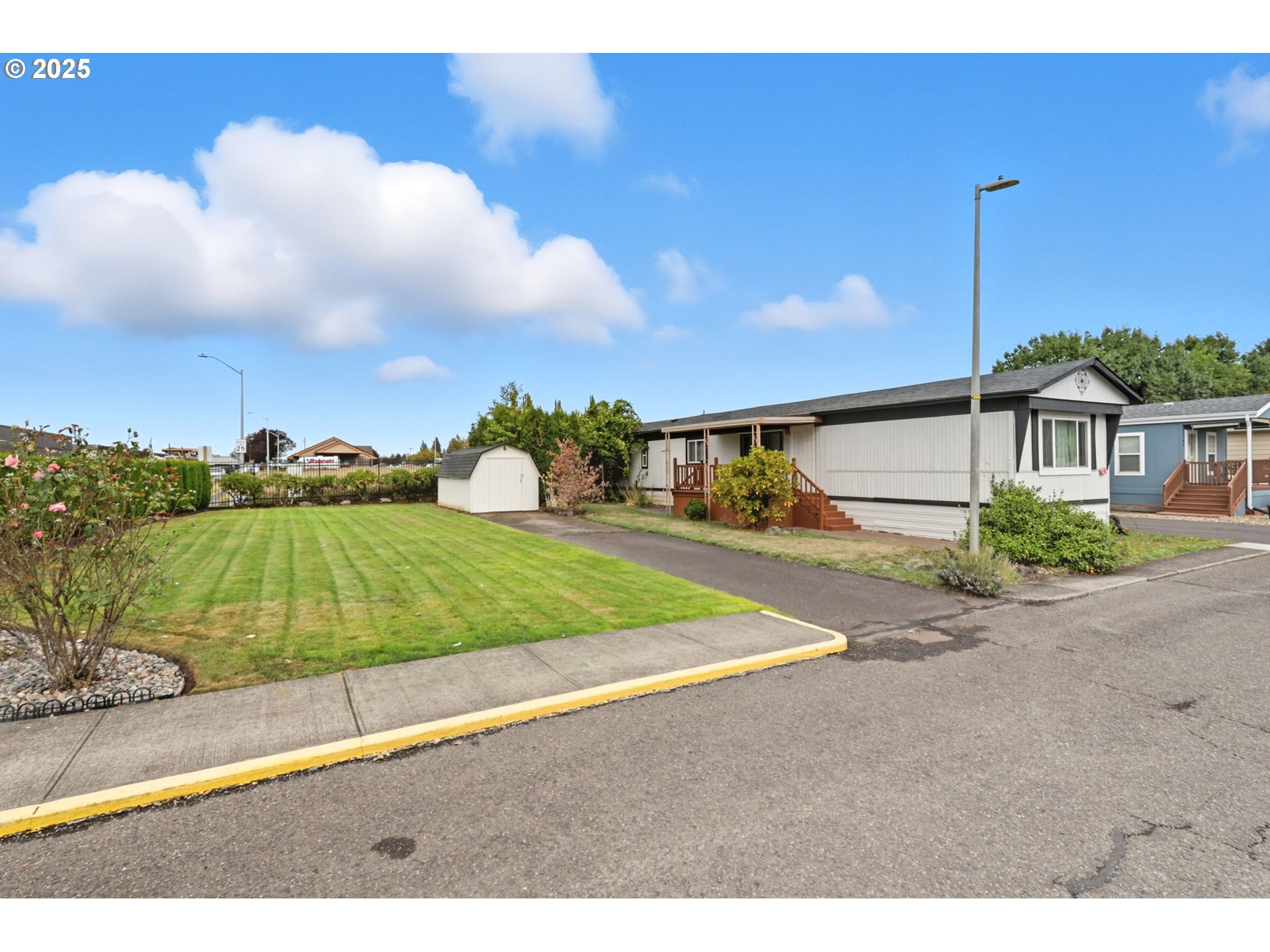 300 Southwest 7th Avenue, Unit 95 Battle Ground, WA 98604 - Photo 2 of 27 a view of a backyard
