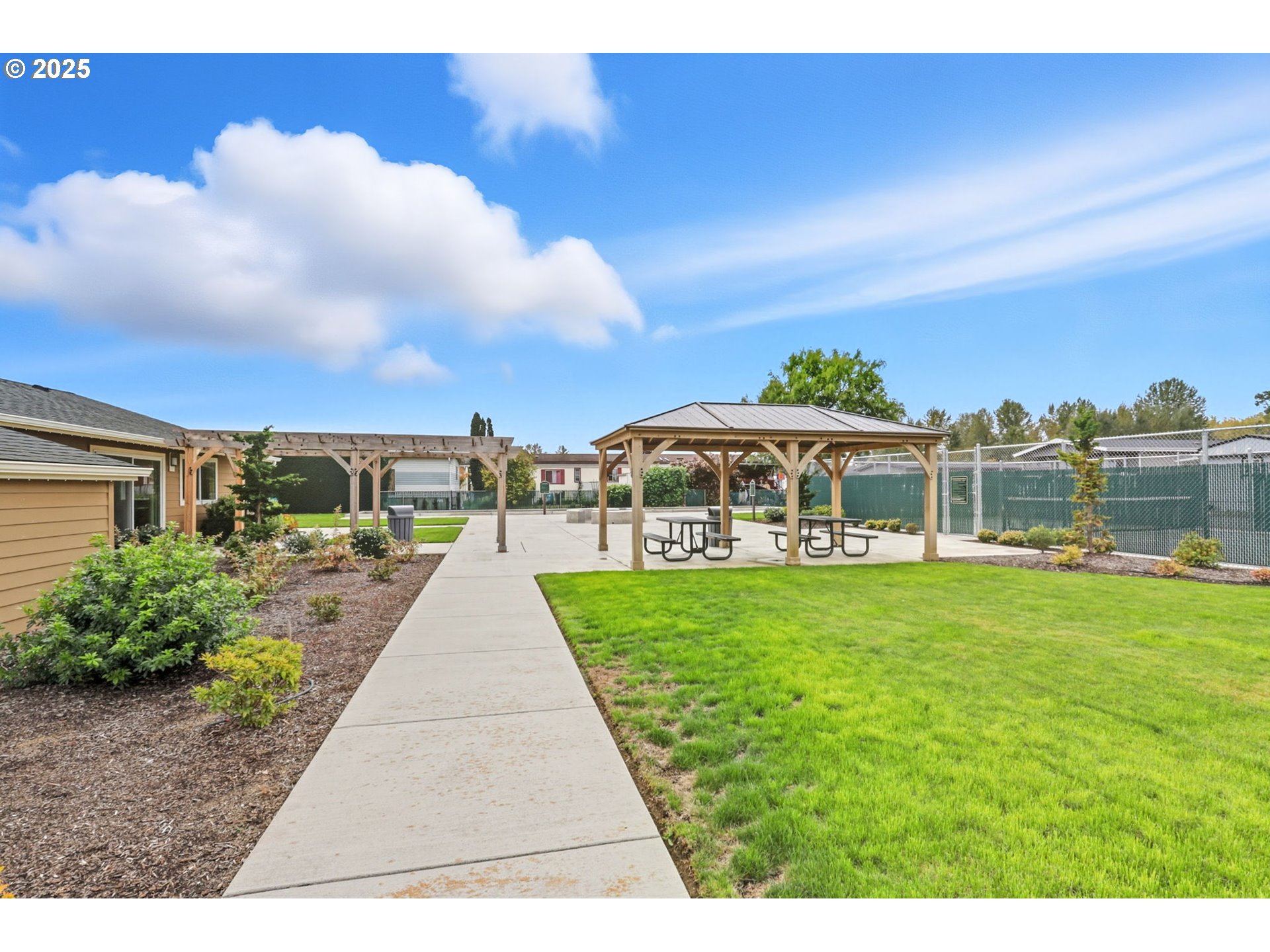 300 Southwest 7th Avenue, Unit 95 Battle Ground, WA 98604 - Photo 22 of 27 a view of a yard with flower plants